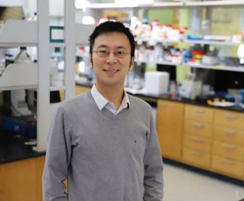 Zhen Ma poses for a photograph in his scientific laboratory.