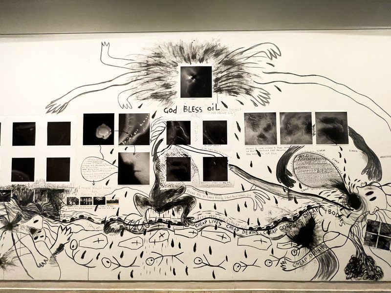 A charcoal drawing of a battle with several square, black & white photographs superposed
