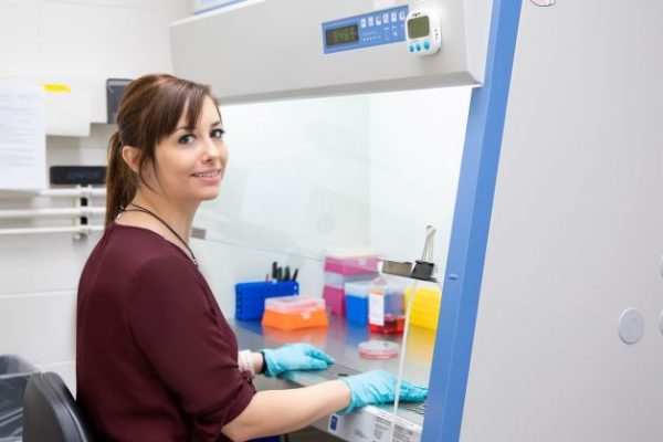 Alison Patteson working in a fume hood in a lab
