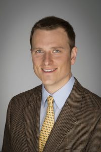 Headshot of Jeremy Steinbacher in a suit