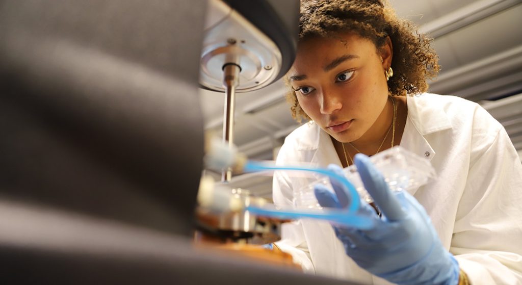 Female at microscope