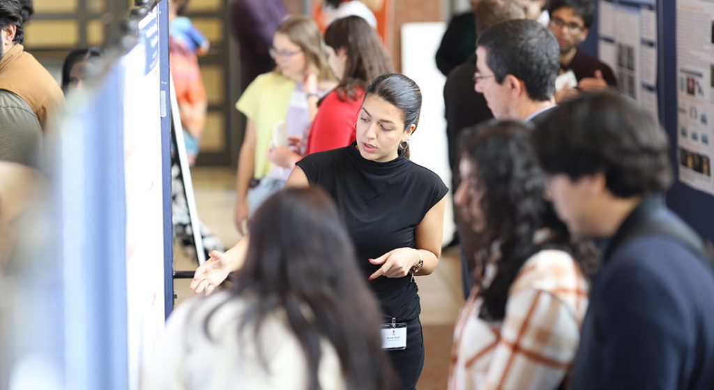 Student presenting poster