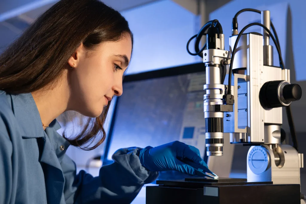 Sadie in lab with microscope